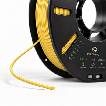 Filorion Reference HS ABS Sarı, 1.75 mm, 1 kg — makara ve filament ucu yakın görünümü