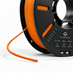 Filorion Reference PET-G Turuncu, 1.75 mm, 1 kg — makara ve filament ucu yakın görünümü